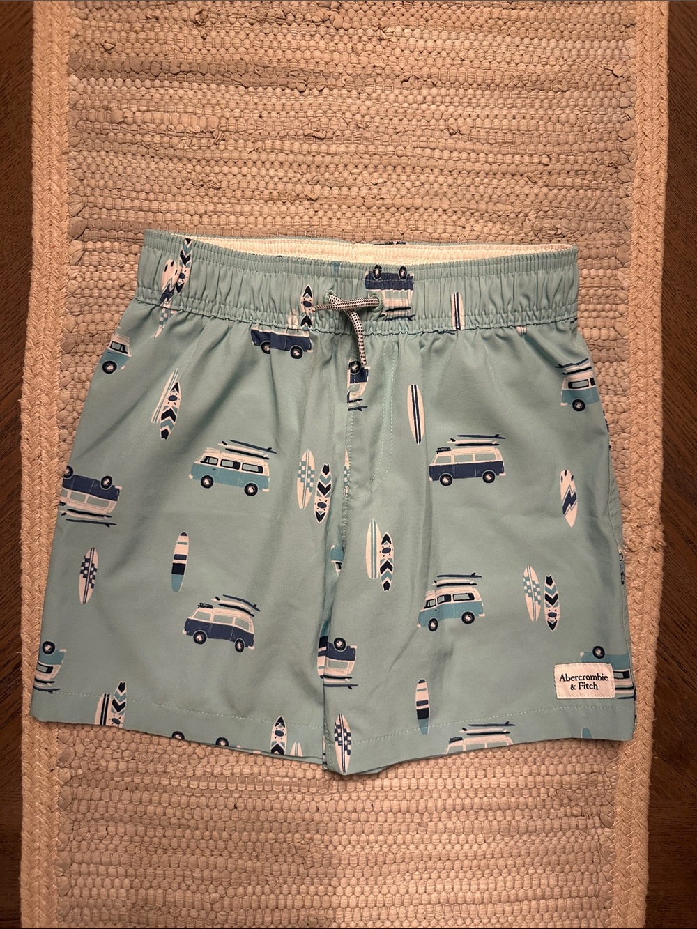 abercrombie kids light teal swim trunks with navy and white surf van print